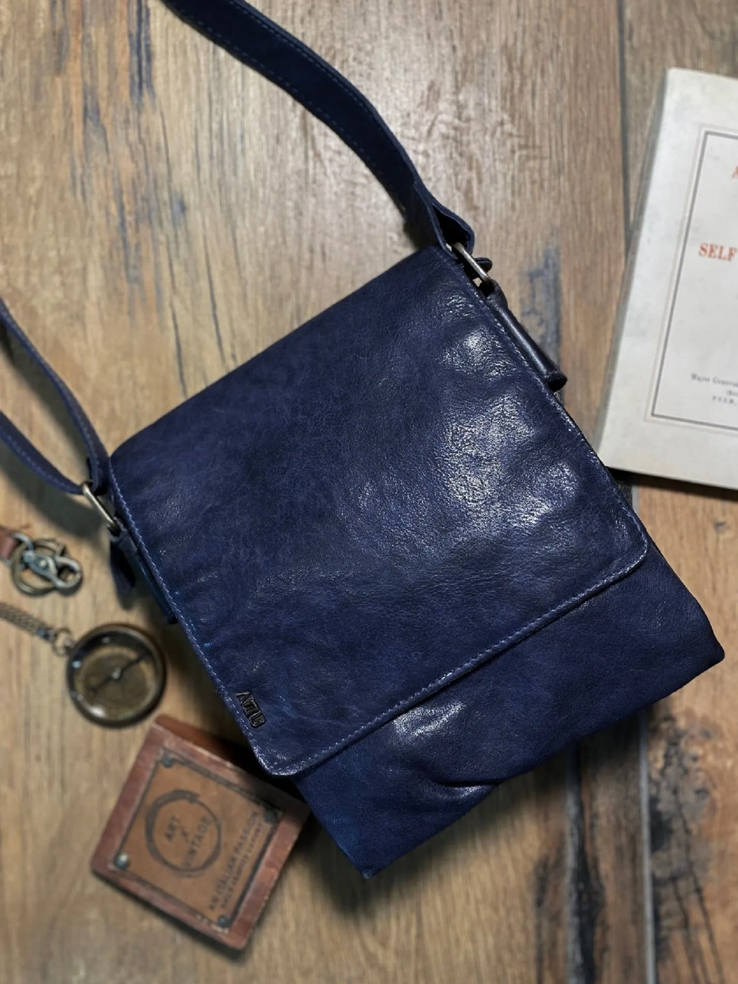 Henry: Navy Flap Bag Cross Body In Veg Tan Leather