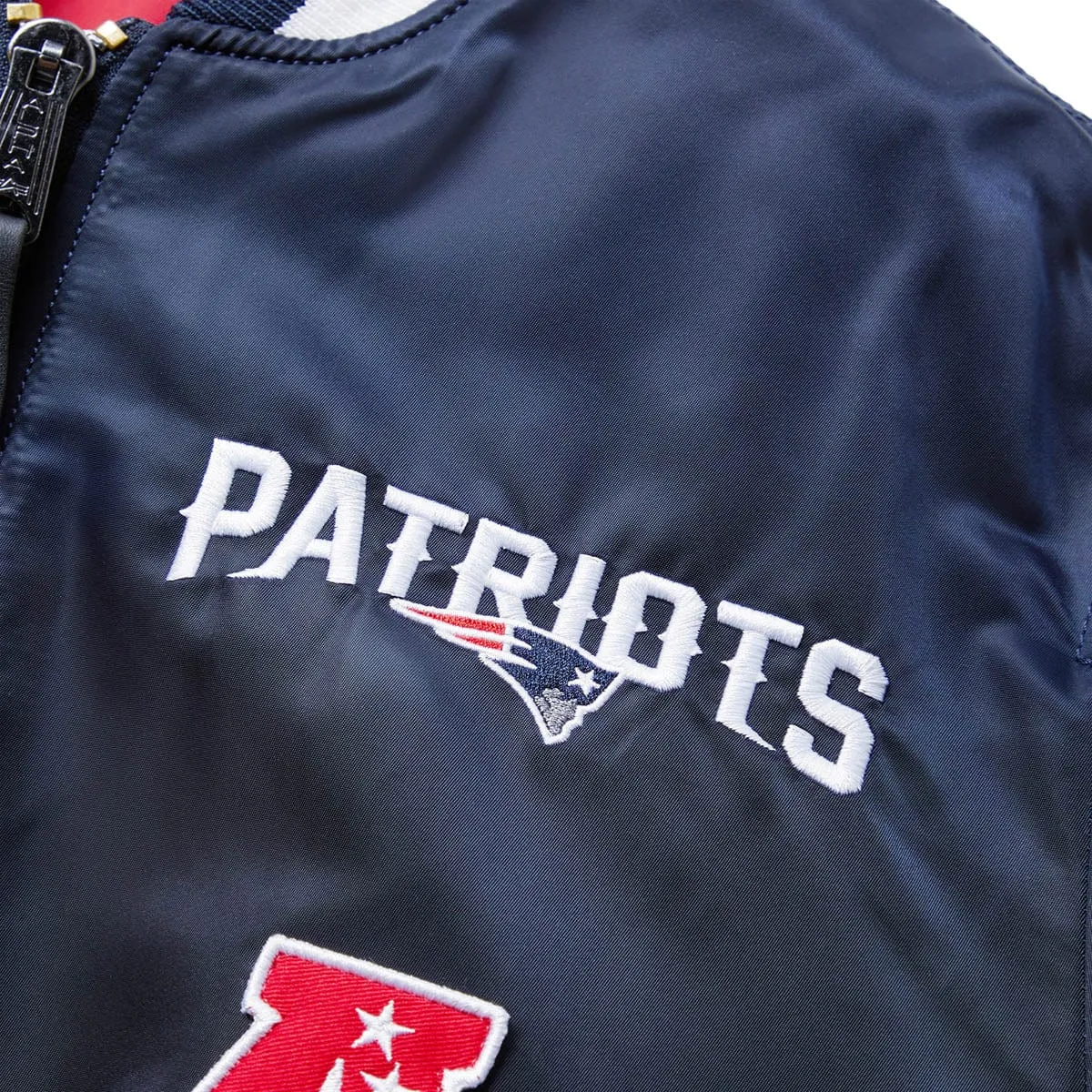X ALPHA INDUSTRIES NEW ENGLAND PATRIOTS BOMBER JACKET